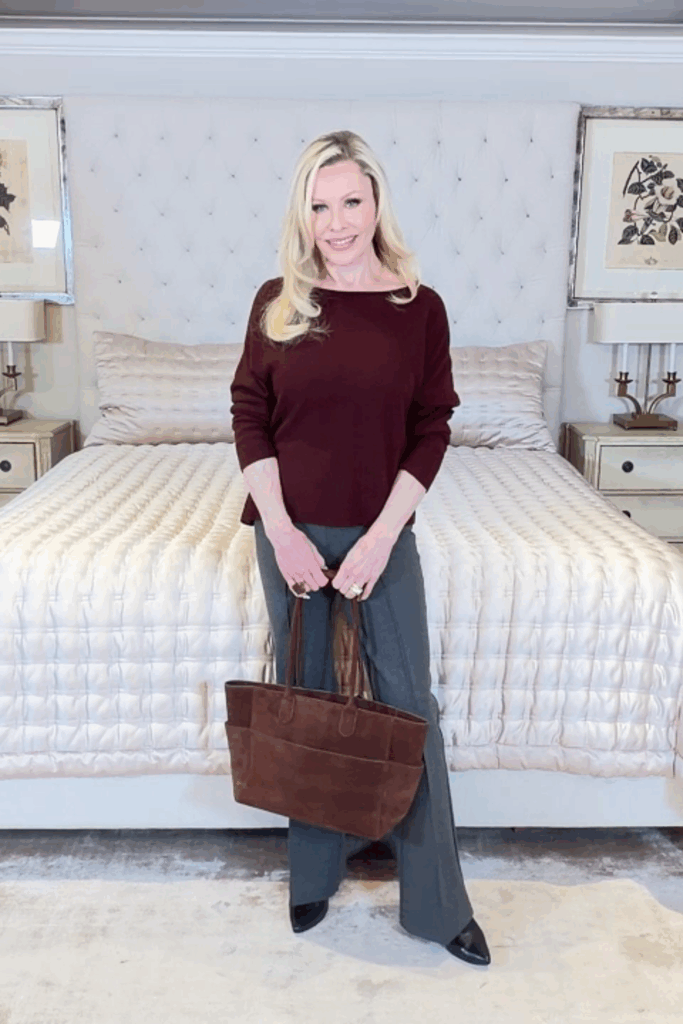 Lynda wearing a burgundy Quince cashmere sweater with gray ponte pants, showcasing Ageless After 55 Fashion with Quince in a polished everyday look.