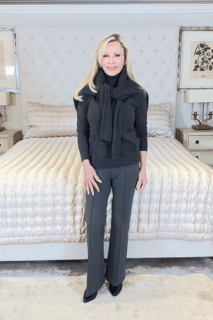 Elegant charcoal cashmere turtleneck outfit styled with a matching sweater draped over the shoulders, representing timeless Ageless After 55 Fashion with Quince.